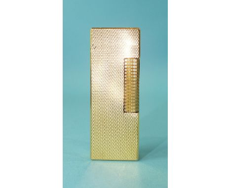 A Dunhill gold plated rollagas lighter.