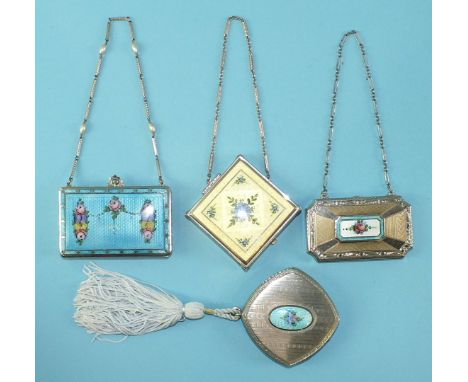 A 1920's American rouge, powder and lipstick compact of rectangular shape, with guilloche enamel lid decorated with roses, on