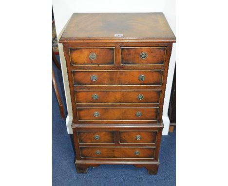 A SMALL MODERN MAHOGANY CHEST, of four small and four long drawers, on bracket feet, approximate size height 76.5cm x width 4