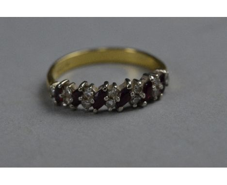 A MODERN RUBY AND DIAMOND HALF ETERNITY RING, six marquise cut rubies and twelve eight cut diamonds, estimated total diamond 