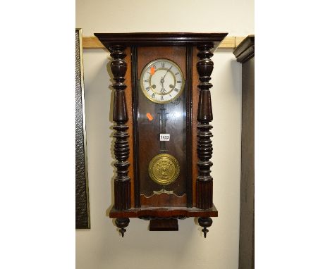 A WALNUT VIENNA WALL CLOCK (two winding keys)