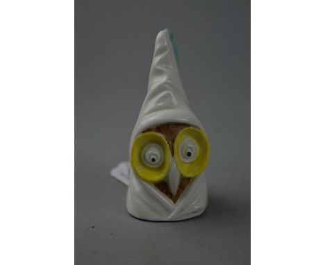 A ROYAL WORCESTER 'OWL' CANDLE SNUFFER