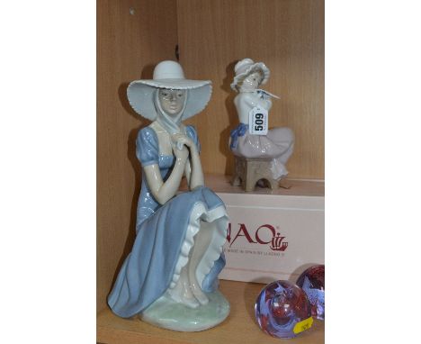 TWO NAO FIGURES, boxed 'A Big Hug' girl and dog No.01049 and larger figure of girl with straw hat (2)