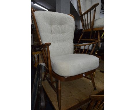 A PAIR OF ERCOL BEECH SPINDLE BACK ARMCHAIRS, with removable cushions and an Edwardian mahogany occasional table (3)