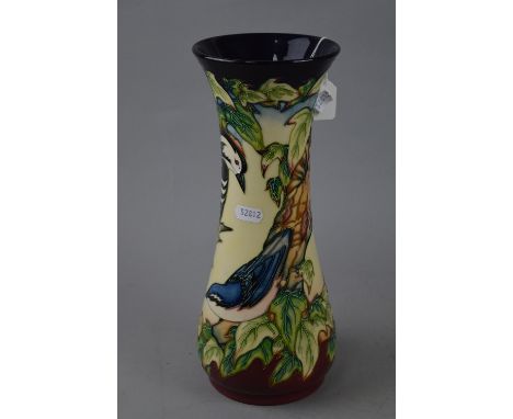 A LARGE MOORCROFT POTTERY VASE, 'Inglewood' pattern decorated with woodpecker and other birds in branches, designed by Philip