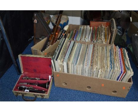 A CASED CONSOLE CLARINET, various other wind instruments, an Autoharp, bongos and two boxes of sheet music
