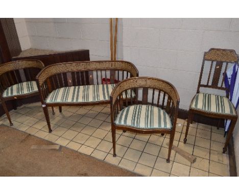 AN EDWARDIAN MAHOGANY AND INLAID FOUR PIECE PARLOUR SUITE, with bowed top rail and bergere back, stripped green and cream uph