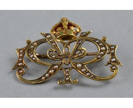 A KING GEORGE V, ROYAL PRESENTATION BROOCH, gold, 15ct marked, GVR cypher inset with enamel and forty seed pearls, two pearls