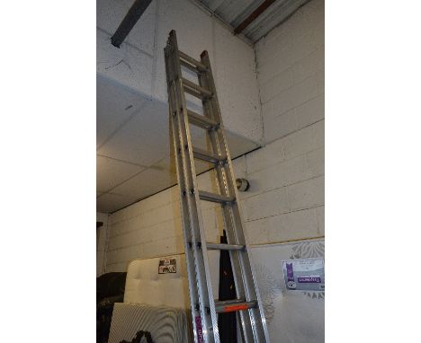 AN ALUMINIUM EXTENSION LADDER, fully extended 6.28m
