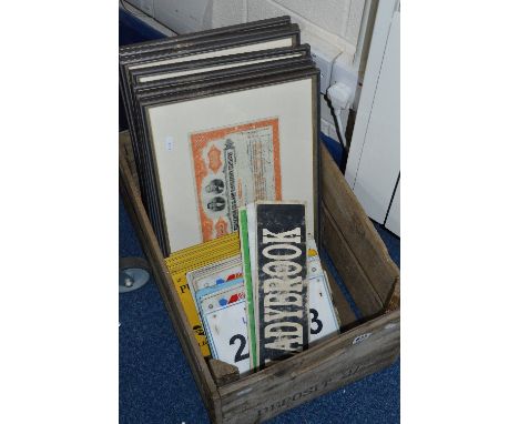 WOODEN CRATE OF FRAMED SHARE CERTIFICATES, card signs and taxi plates, together with an oak framed mirror and a pair of orien