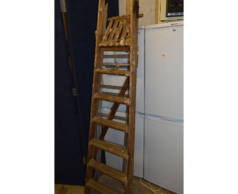A SET OF WOODEN STEP LADDERS, and a set of aluminium step ladders