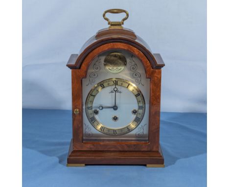 A John Morley reproduction broken arched top bracket clock with gilt and silvered dial.  Westminster chime on gongs