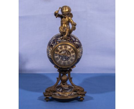 A small cloisonné clock with cherub 21cm