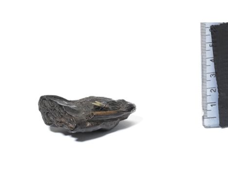 A kurogaki (black persimmon) wood netsuke of a lotus-seed podAfter Ritsuo, 19th centuryOf elongated, asymmetric triangular fo