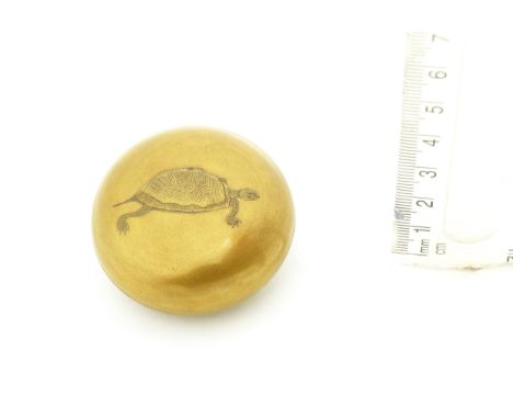 A gold-lacquer two-part manju netsukeBy Koami Nagaharu, 19th centuryThe kinji ground lacquered with a simple design of a walk