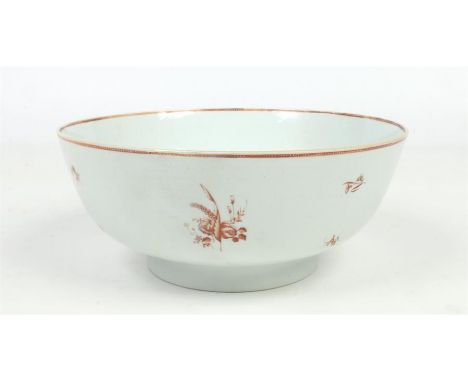 An 18th century Chinese export punch bowl. Painted in monochrome red enamel and gilt with scattered sprigs, 26.5cm diameter.&
