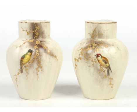 A pair of Grainger &amp; Co. Royal Worcester China Works fluted high shouldered vases. Ivory ground and decorated with birds 