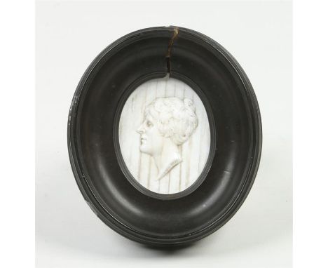 An early 19th century oval glass paste portrait miniature after William Tassie in moulded ebonized frame. Inked verso naming 