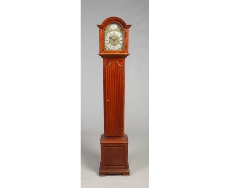 A George V mahogany cased eight day Grandmother clock. With brass arch top dial, quarter and Westminster chime, 170.5cm high.