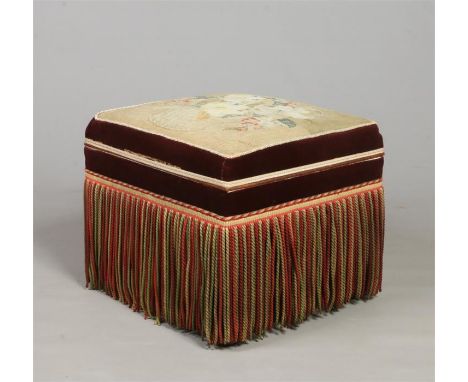 A Victorian ottoman, upholstered in velvet, with tapestry seat and fringed sides, 50cm high.&nbsp;