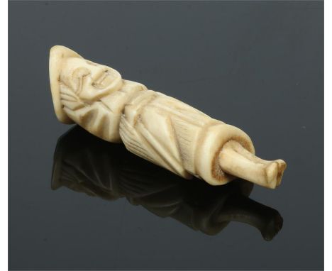 A Japanese Meiji period carved antler netsuke. Modelled in the form of a standing Dutch clergyman, 6.25cm.Condition report in