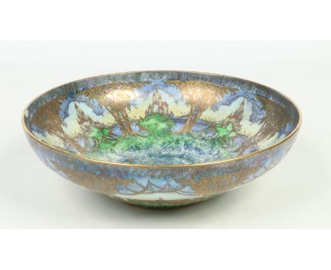 A Royal Worcester ogee shaped lustre glazed bowl. Decorated in the Fairyland style with citadels trees and flowers. Gilt mark