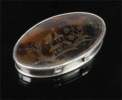 An 18th century ovoid silver snuff box set with tortoiseshell panels. The top incised with a landscape incorporating a church