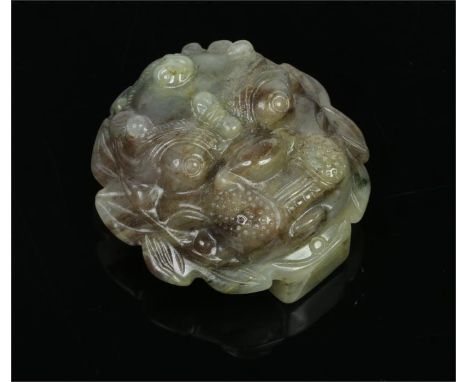 A well carved Chinese mottled spinach jade buckle in form of a lion mask, 5cm wide.&nbsp;Condition report intended as a guide