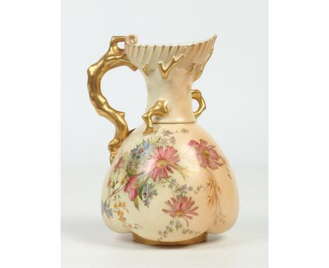 A Royal Worcester shell moulded ewer with naturalistic coral formed handle. Blush ground and painted with flowers. Printed pu