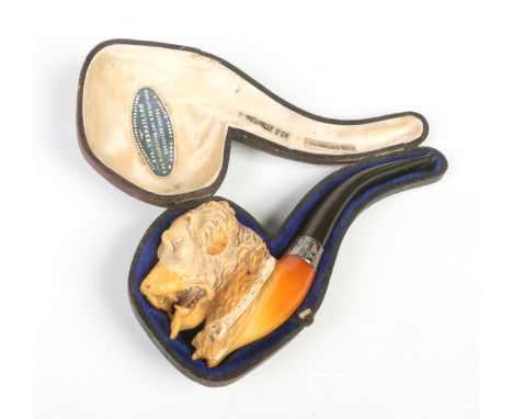 A cased Meerschaum pipe carved to portray a St. Bernard. With silver collar assayed London 1930, 15cm.Condition report intend