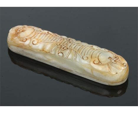 A Chinese mutton fat jade scroll weight of elongated ovoid form. Carved with four stylized fruit bats. Incised Tongzhi  seal 