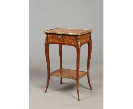 An 18th century French kingwood and tulip wood parquetry side table by Charles Topino. With gilt metal mounts and raised on s