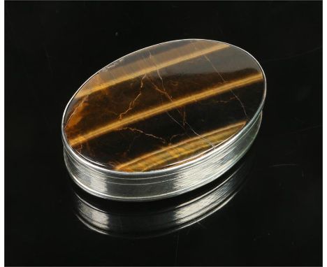 A George III silver ovoid snuff box by John Reily. Set with two tigers eye panels and with engine turned engraving. Assayed L