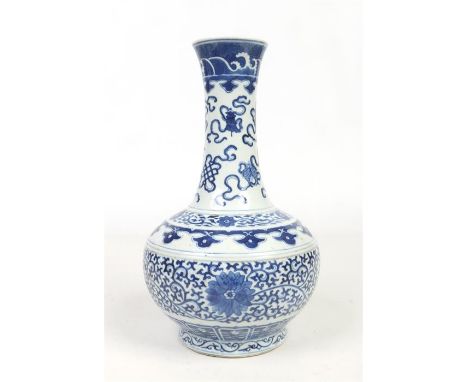 A 19th Chinese blue and white bottle shaped vase. Painted in underglaze blue with precious objects to the neck, ruyi motifs t