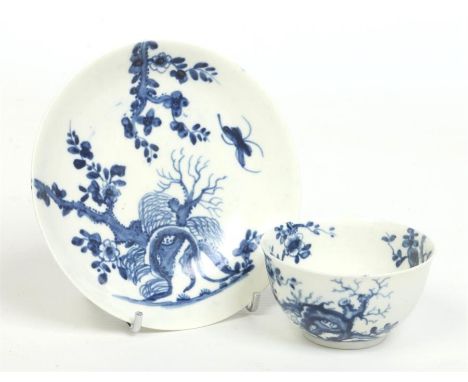 A Worcester tea bowl and saucer. Painted in underglaze blue with the Prunus Root pattern. Workman's marks c.1757-59, saucer 1