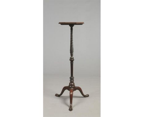 A Georgian mahogany torchere. With octagonal top raised on a twisted column on a plain cabriole tripod base, 1m 11cm.Conditio