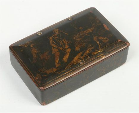 A Georgian papier mache snuff box with hinged cover. Lacquered and decorated in gilt with a resting huntsman and his hound, 8