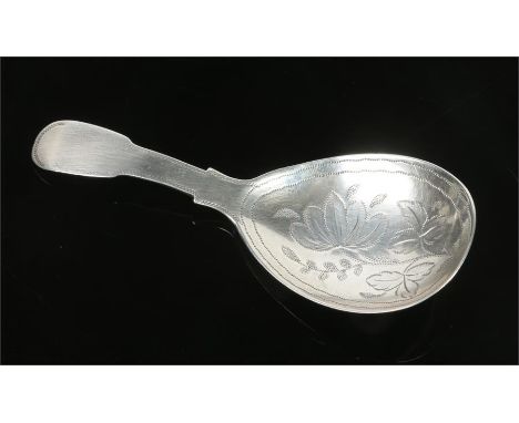 A George III silver fiddle pattern caddy spoon, with wrigglework fig shaped bowl. Assayed London 1785, 9 grams, 8.25cm.Condit