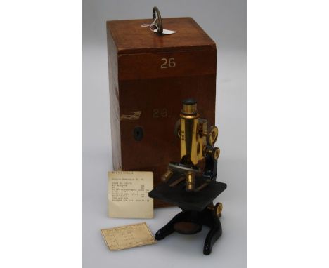 A Japanned steel and brass Leitz microscope numbered 270871, with two objectives in a fitted wood carry case