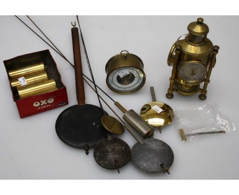 Four cylindrical brass Vienna clock weights, 10cm, six various pendulum, a brass aneroid barometer and a brass lantern clock/