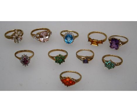 A collection of ten gem-set 9ct gold rings including opal, ruby and diamond, tanzanite, blue topaz etc. The vast majority siz