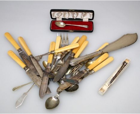 A pair of silver plated salmon servers, two silver teaspoons, a part set of ivory handled fish knives and forks, a silver pla