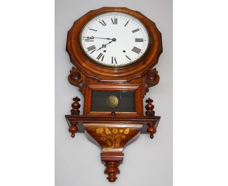 A late 19th century American walnut cased drop dial wall clock, the eight day movement striking on a bell, faced by 12'' Roma