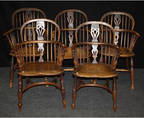 A pair of 19th century yew Windsor double hoop and stick back armchairs, each with elm saddle seat, on splayed ring turned su