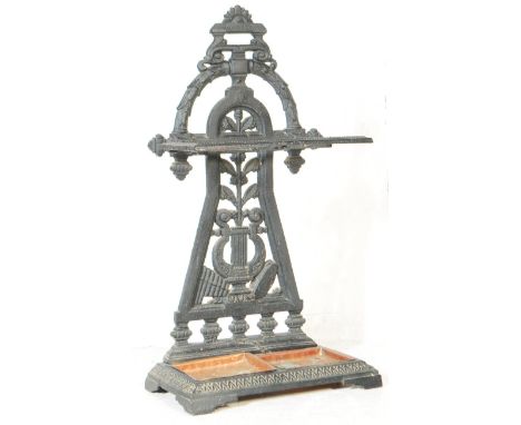 A late 19th / early 20th century cast metal ebonised Coalbrookdale type umbrella / stick stand. The umbrella stand, having an