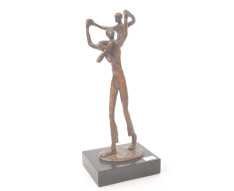 A vintage 20th century bronze abstract figure. Proud father figure with child on shoulders. Signed to base. Raised on a plint