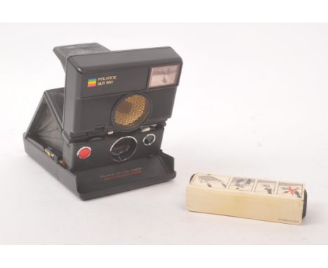 Polaroid - A late 20th century 1980s Polaroid SLR 680 folding instant SLR camera. The camera using Polaroid 600 film, having 