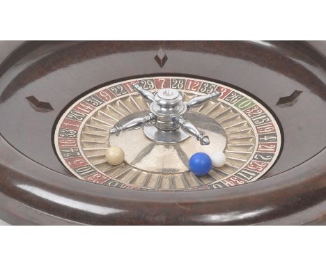 Chad Valley - A 1930s vintage Chad Valley bakelite roulette wheel with balls. Measuring approx. 32cm diameter.&nbsp;