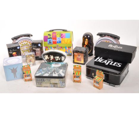 The Beatles - A collection of Beatles memorabilia to include lunchboxes, small tin boxes, 2 sided 300 piece puzzle, Clock, sm