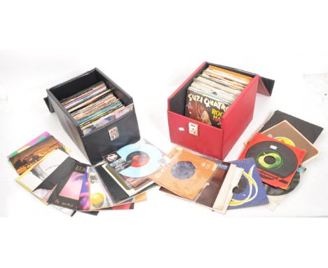 A vintage 20th century 45rpm vinyl record singles. To include, Elvis Priestly, George Harrison, Suzi Quattro, Cliff Richard, 